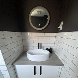 Contemporary Bathroom Renovation with White Metro Tiles and black accessories