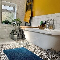 Monochrome bathroom customer project with bold yellow walls