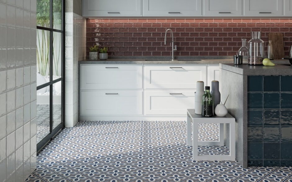 Image of a kitchen with burgundy metro tiles on the wall and Atenea Blue and White Floor Tiles