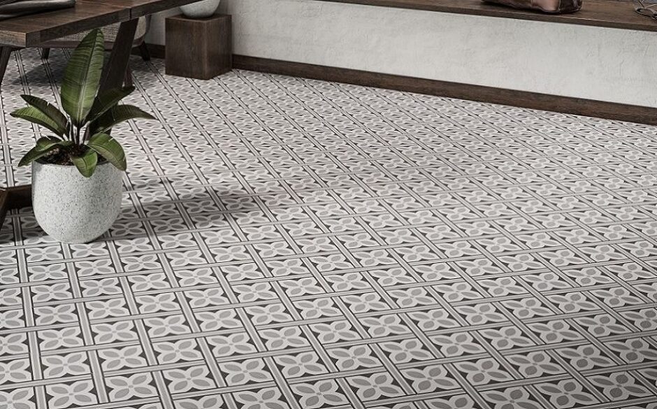 A floor with geometric patterned tiles along with a pot plant