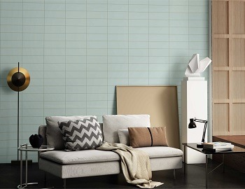 Grey wall tiles in a modern living room with a sofa