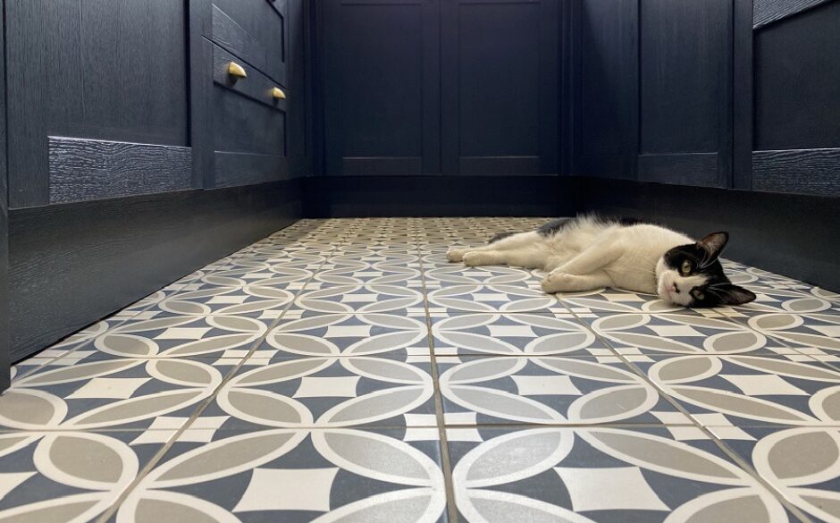 Blue patterned tiles in customer kitchen with cat relaxing on the floor
