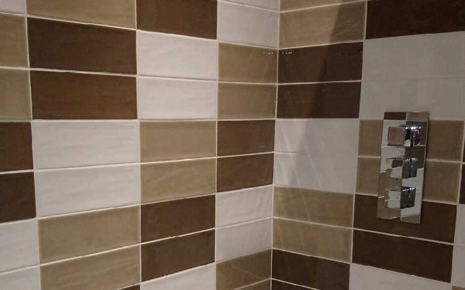 Brown, beige and white metro tiles tiled in pairs above each other