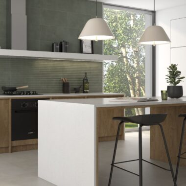Sage Kitchen Tiles in a modern kitchen with large window and breakfast bar