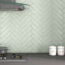 Captiva Sage Green Metro Tiles in a kitchen setting with the tiles in a herringbone layout