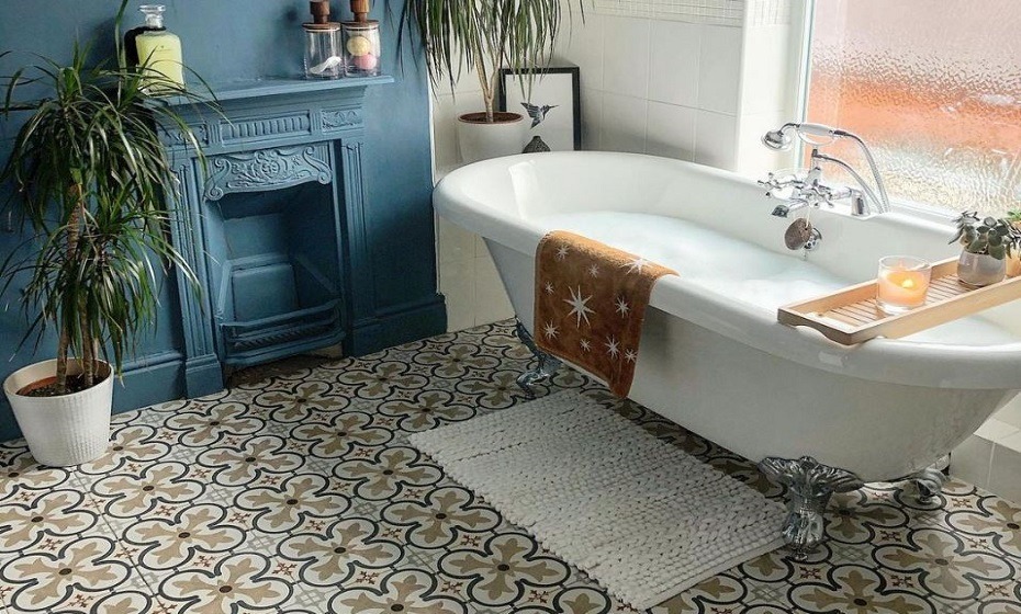 Customer bathroom project with Boulevard tiles on the floor and a painted blue feature wall with the fireplace also painted blue