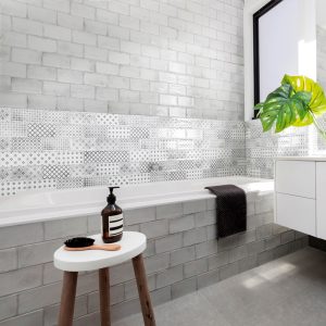 Vita Black and White Decorative Tiles - Bathroom setting with a bath and stool with toiletries