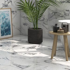Valeria White Marble Look Floor Tiles - floor with a plant pot, and small stool with toiletries on.