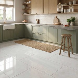 Scambio White 1200 x 600 porcelain floor tiles in a contemporary kitchen with sage green cabinetry and polished marble-effect finish.