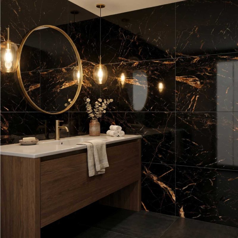 Cabeen Black and Gold porcelain wall tiles in a luxurious bathroom with dramatic marble-effect veining and warm metallic accents.